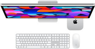 Mac mini unter dem Studio Display platziert, Magic Keyboard mit Ziffernblock, Magic Mouse